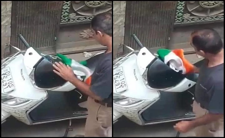 Man Cleaning Scooter with Tiranga in delhi