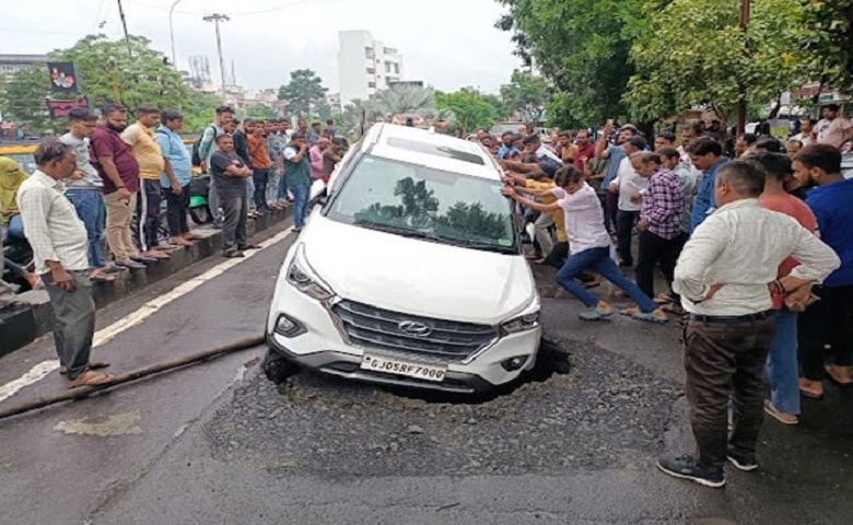 car got stuck in collapsed road